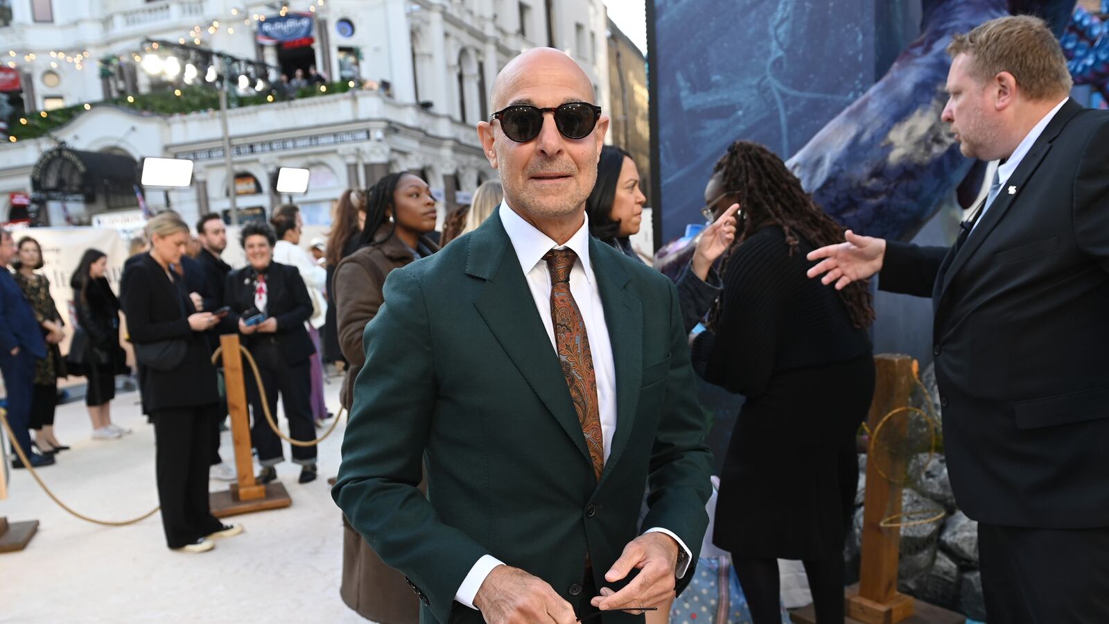 Stanley Tucci is seen in a green suit at a film premiere in London in May 2023.