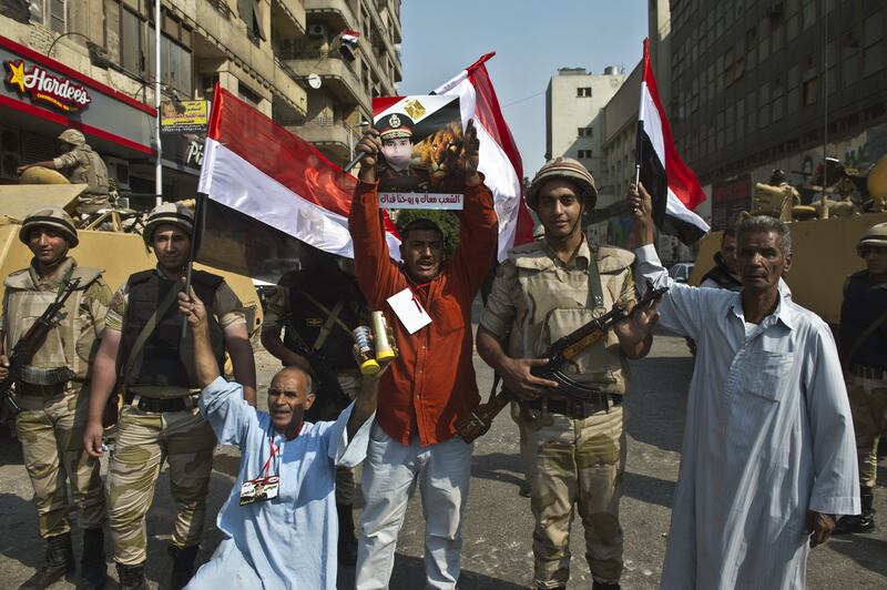 articles/2013/10/10/in-deeply-polarized-egypt-revolution-s-social-justice-slogans-are-seldom-heard/OZ_Cairo_October_6_qlpccb