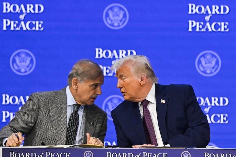 President Donald Trump (R) and Pakistani Prime Minister Shehbaz Sharif (L) attend the Peace Council meeting held during the 56th World Economic Forum in Davos, Switzerland on January 22, 2026.