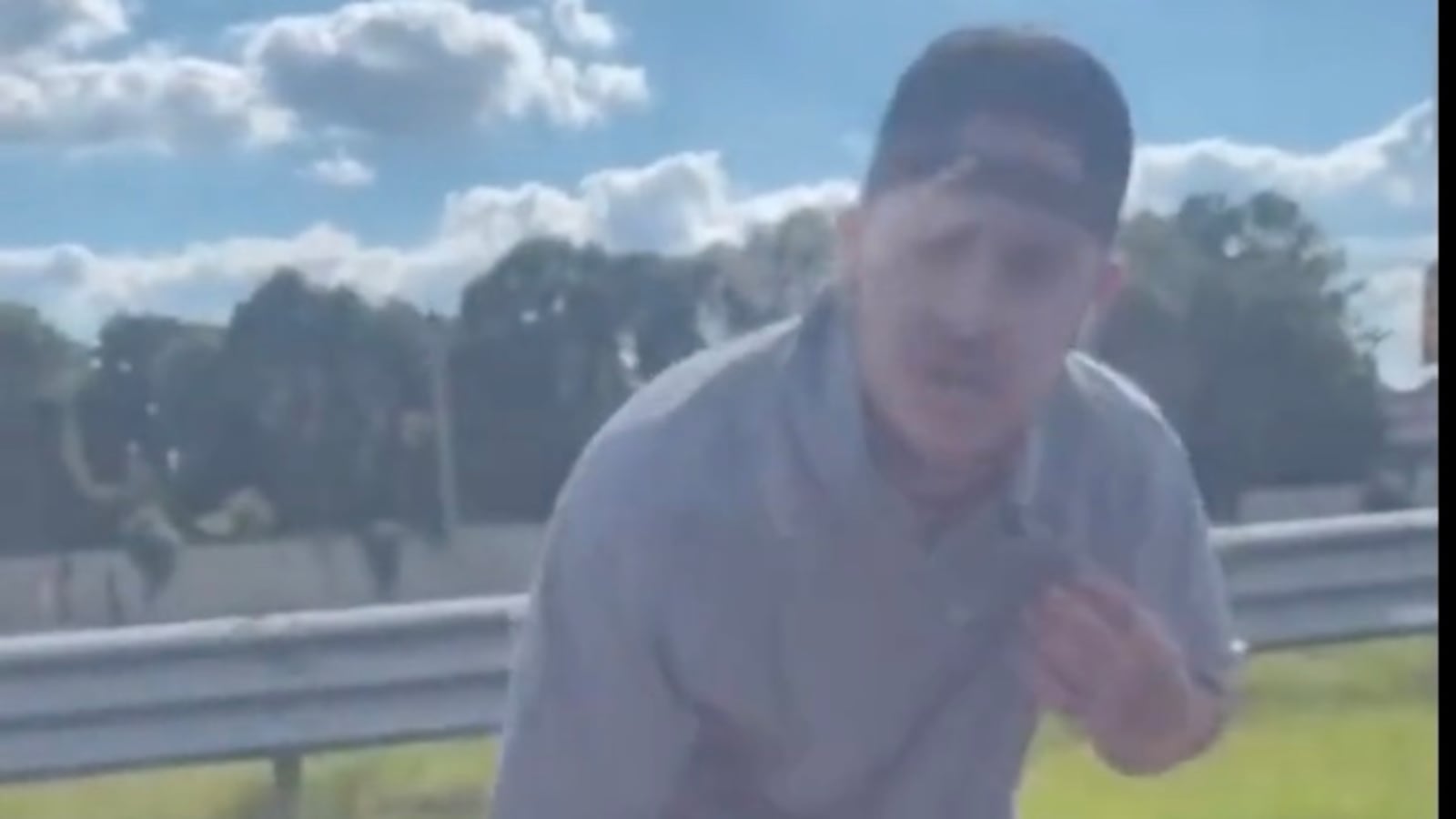 A man wearing a Green-Watt shirt during a racist rant