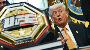 A UFC championship belt is displayed as US President Donald Trump speaks about the upcoming "UFC Freedom 250" event, in the Oval Office of the White House on May 6, 2026, in Washington, DC. An Ultimate Fighting Championship event will be staged on the White House's South Lawn in June. The June 14 event has been dubbed "UFC Freedom 250," in reference to the United States' 250th anniversary celebrations this summer. (Photo by Kent NISHIMURA / AFP via Getty Images)