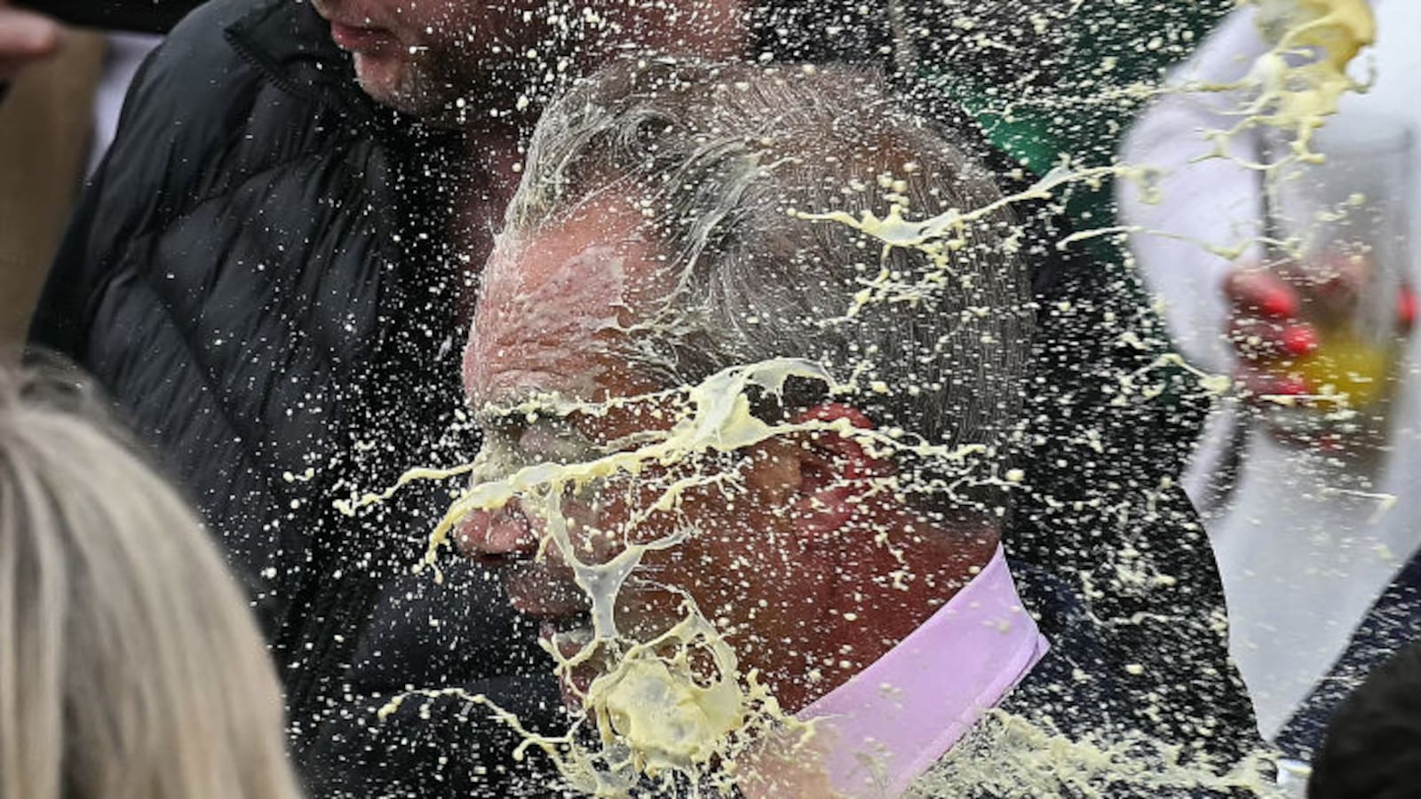 Nigel Farage is hit in the face with a milkshake while campaigning in Clacton.