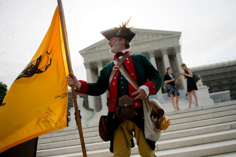 articles/2012/06/28/is-the-supreme-court-s-health-care-ruling-a-turning-point-in-constitutional-law/teapartier-obamacare-barnett-teaser_nejyhs