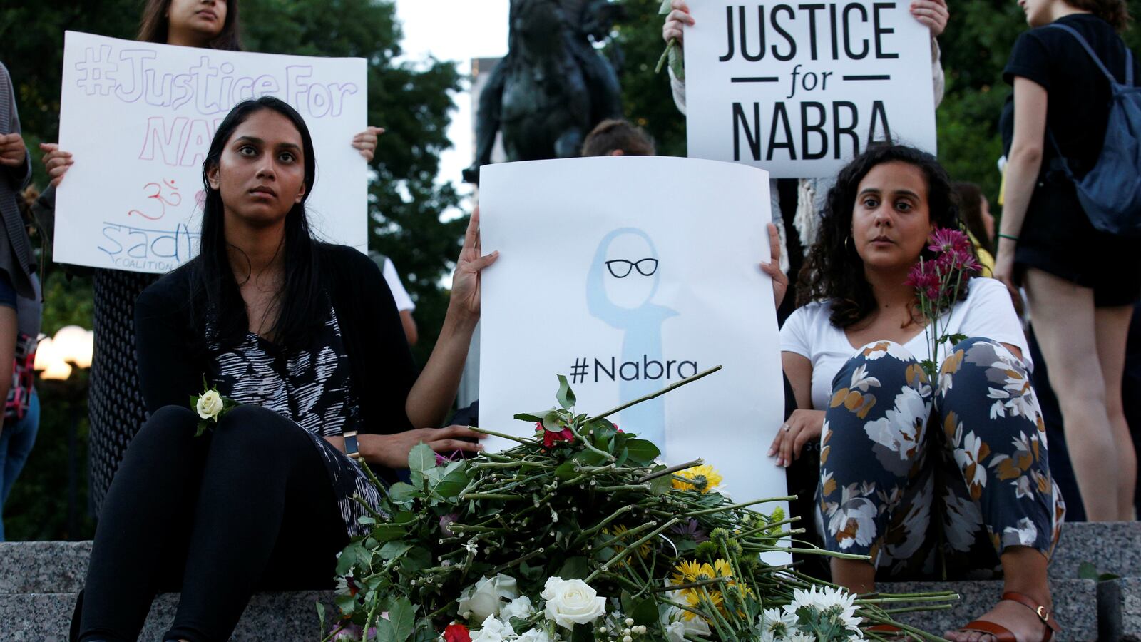 Attendees leaves flowers for Nabra Hassanen, a teenage Muslim girl killed by a bat-wielding motorist near a Virginia mosque, during a vigil in New York City, U.S. June 20, 2017.