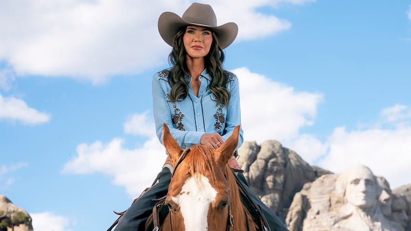 Secretary of Homeland Security Kristi Noem rides a horse while filming an ad at Mount Rushmore National Memorial in South Dakota, Oct. 2, 2025. (DHS photo by Tia Dufour)