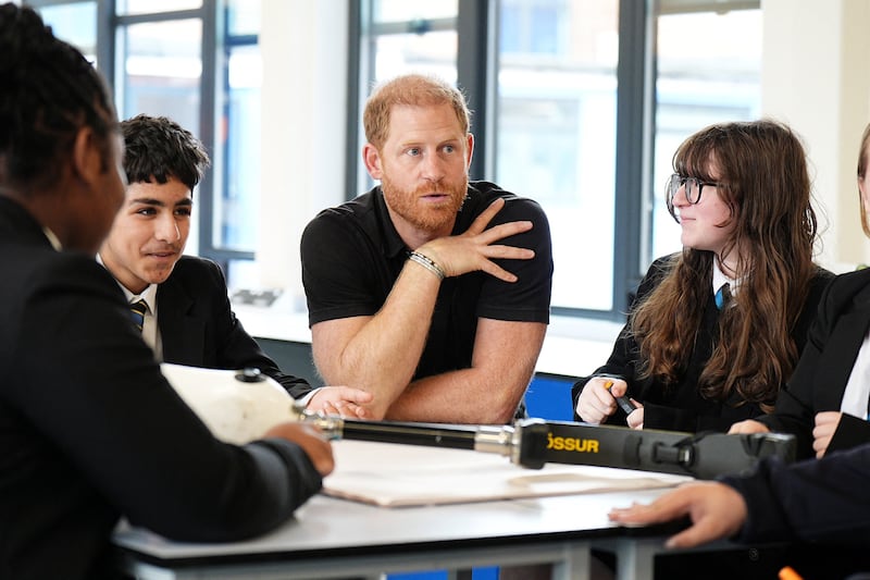 Prince Harry speaks to pupils as he visits Ninestiles School in Birmingham, Britain, September 18, 2026.