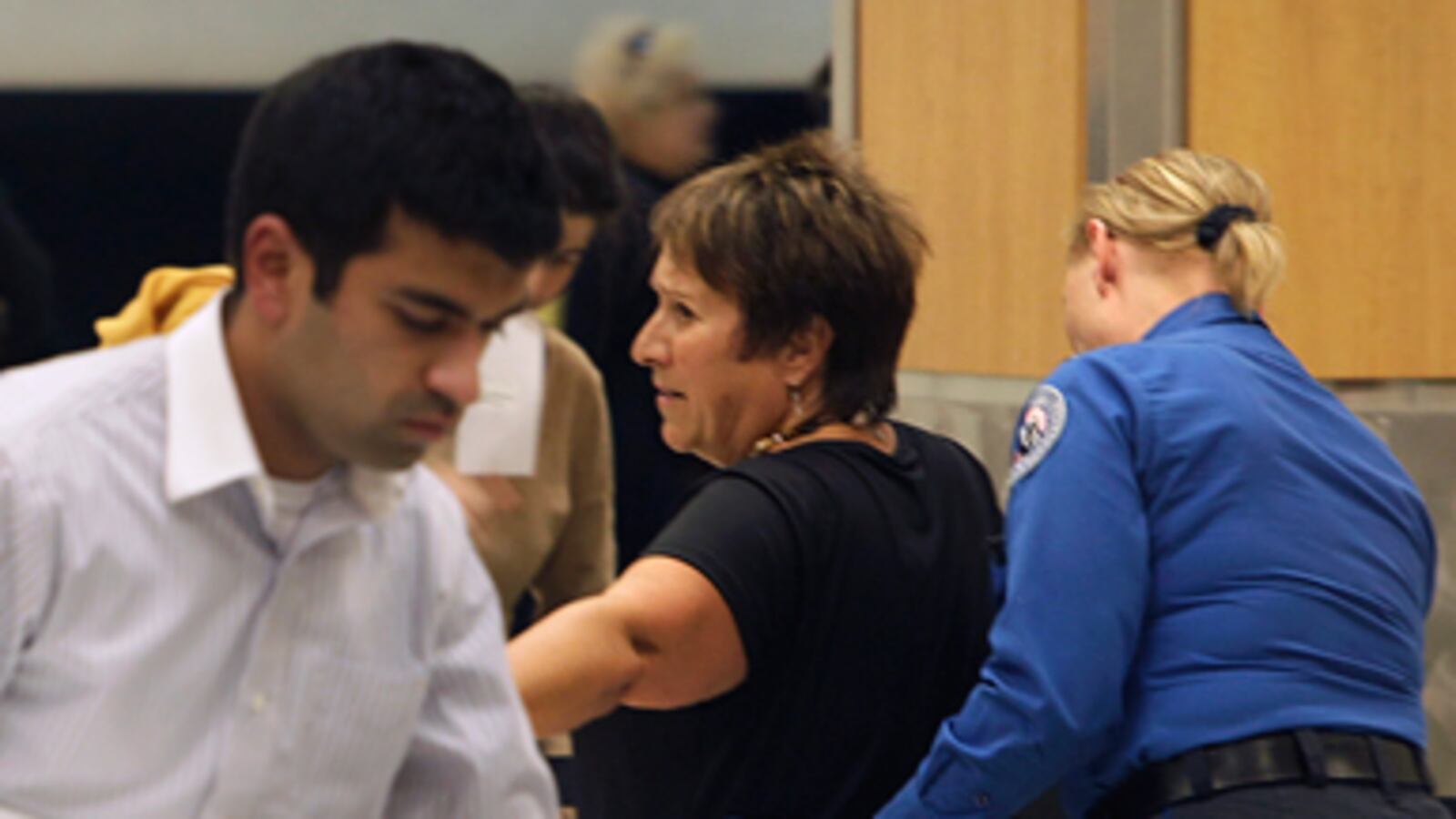 articles/2010/11/19/airport-security-body-scans-and-tsa-searches-too-intrusive/poole-airport-screening_142418_bwfrpg