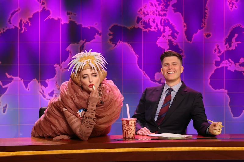 SATURDAY NIGHT LIVE -- Episode 1863 -- Pictured: (l-r) Sarah Sherman as Robert F. Kennedy Jr.'s Brain Worm and anchor Colin Jost during Weekend Update on Saturday, May 11, 2024 -- (Photo by: Will Heath/NBC via Getty Images)