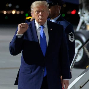 President Donald Trump walks off Air Force One on his West Coast trip.