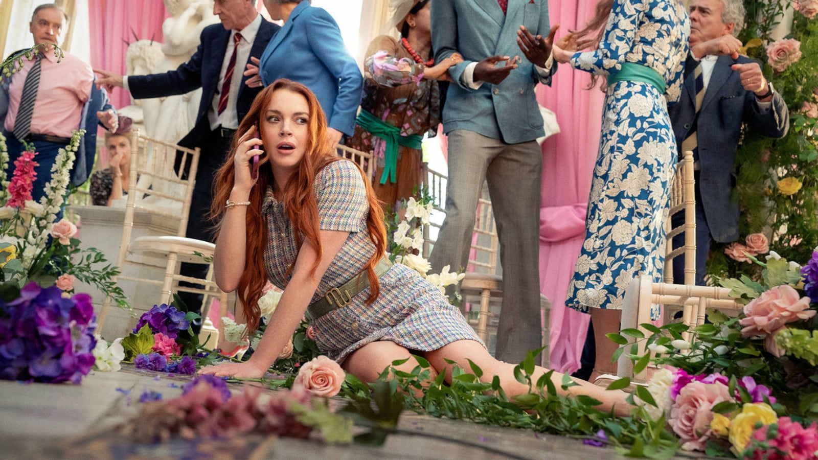 Lindsay Lohan sprawled on the ground in a still from ‘Irish Wish’