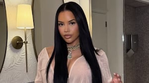 Lateysha Grace in a beige dress