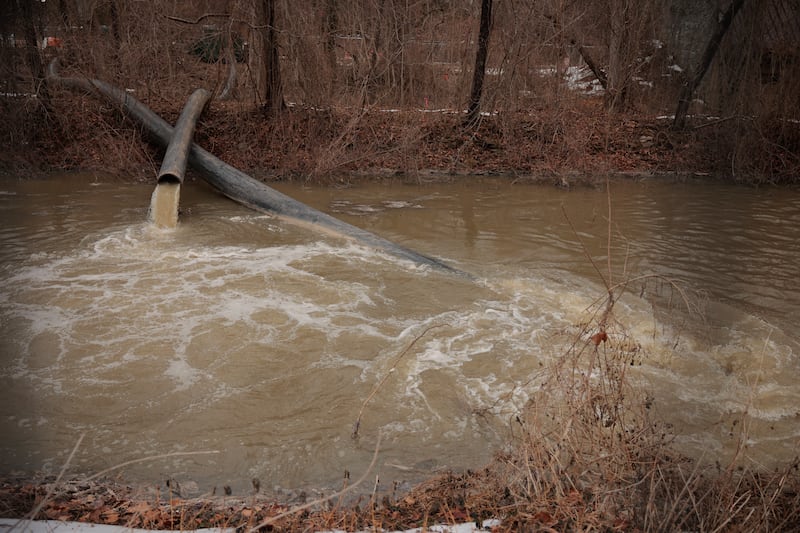 CABIN JOHN, MARYLAND - FEBRUARY 16: Pumps and pipes divert raw sewage into the C&O Canal and around a broken section of the Potomac Interceptor, a six-foot-wide pipe that collapsed on January 19, in between the Clara Barton Parkway and the canal on February 16, 2026 in Cabin John, Maryland. More than 300 million gallons of raw sewage poured into the Potomac River after the underground pipeline collapsed on January 19. According to the Potomac Riverkeeper Network and researchers at the University of Maryland, fecal-related bacteria and disease-causing pathogens in the Potomac River reached levels more than 2,700 times the safe limit. (Photo by Chip Somodevilla/Getty Images)