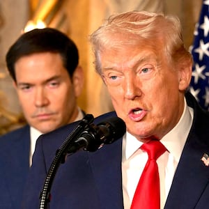 US Secretary of State Marco Rubio looks on as US President Donald Trump speaks