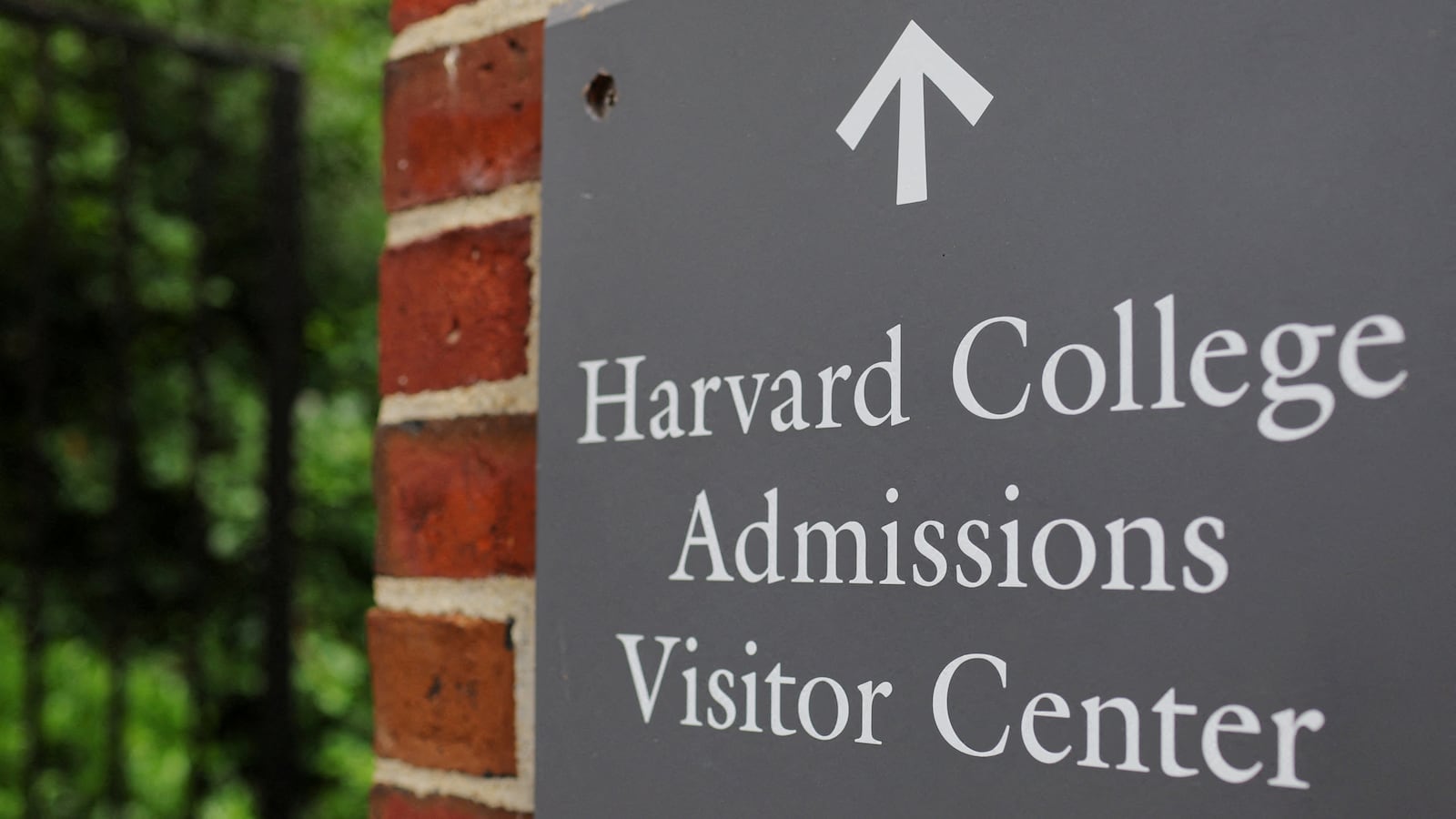 A sign points the way to the Harvard College Admissions Visitors Center at Harvard University in Cambridge, Massachusetts.
