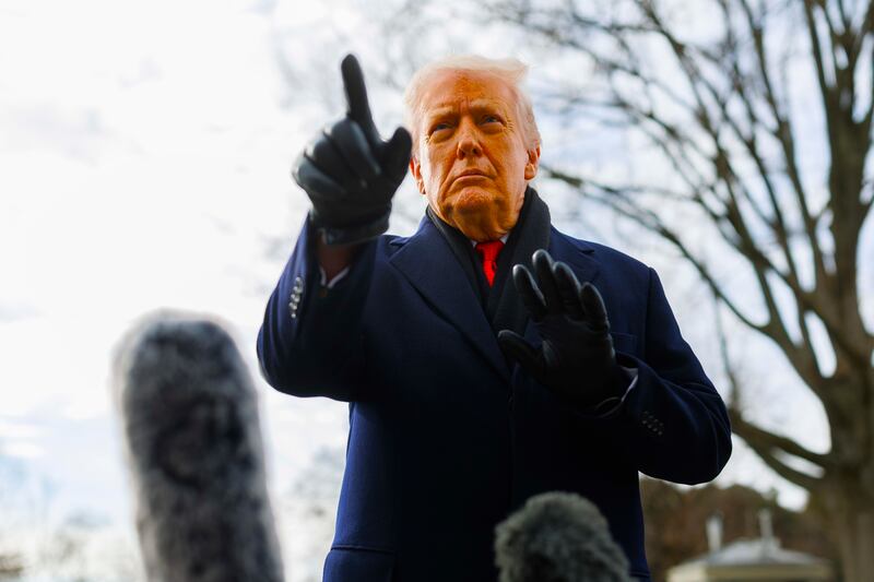 President Donald Trump speaks to reporters on the South Lawn before boarding Marine One at the White House on January 16, 2026 in Washington, DC.