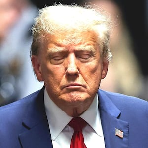 Former U.S. President Donald Trump closes his eyes as he leaves court during his trial for allegedly covering up hush money payments