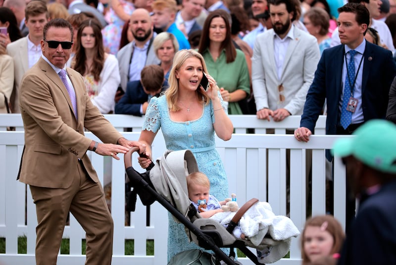 WASHINGTON, DC - APRIL 21: White House Press Secretary Karoline Leavitt and her husband Nicholas Riccio arrive to the White House Easter Egg Roll on the South Lawn of the White House on April 21, 2025 in Washington, DC. The White House said they are expecting thousands of children and adults to participate in the annual tradition of rolling colored eggs down the White House lawn, a tradition started by President Rutherford B. Hayes in 1878. (Photo by Chip Somodevilla/Getty Images)