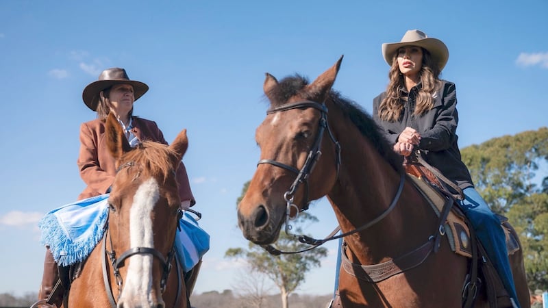 Homeland Security Kristi Noem rides a horse alongside Argentina's Security Minister Patricia Bullrich.