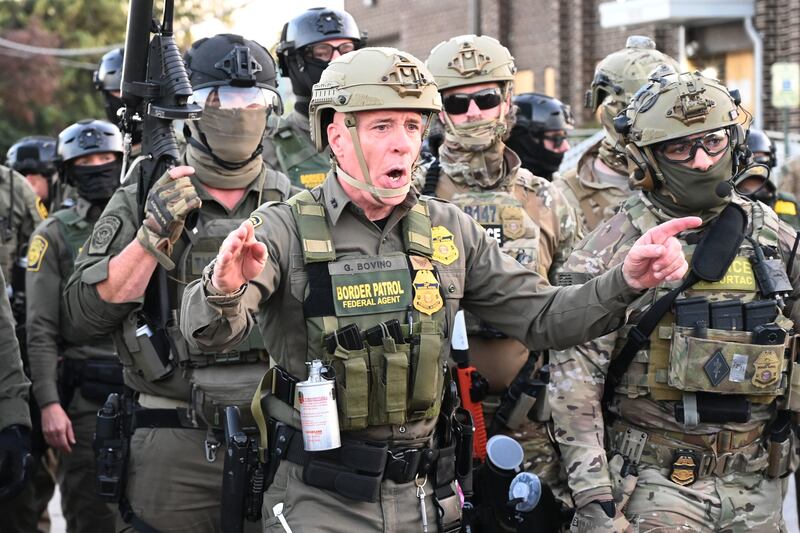 Border Patrol Chief Gregory Bovino of the El Centro Sector stands amid a protest outside an ICE facility