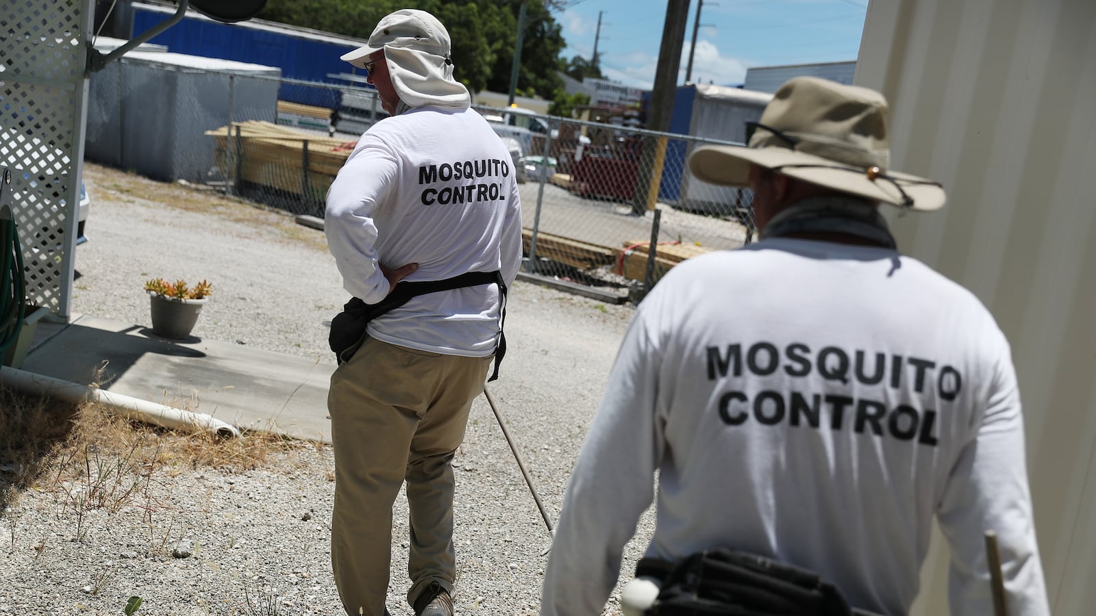 The Florida Keys Mosquito Control Department inspects a neighborhood for mosquitos and breeding sites as the county works to eradicate mosquitos that carry dengue fever.