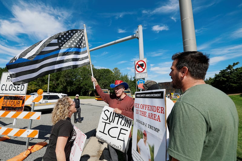 Anti- and pro-Trump protesters confront each other as President Donald Trump attends the Presidents Cup golf tournament at Medinah Country Club in Medinah, near Chicago, Illinois, September 27, 2026.
