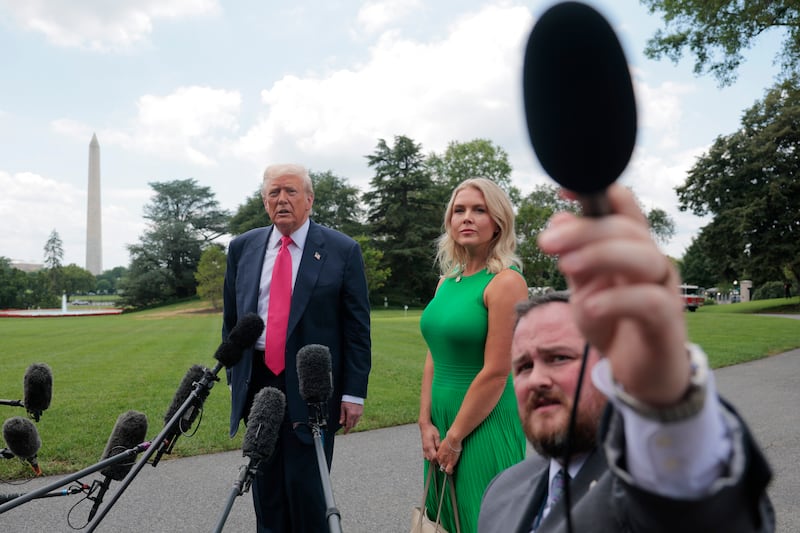 U.S. President Donald Trump, joined by White House Press Secretary Karoline Leavitt, speaks to the media.