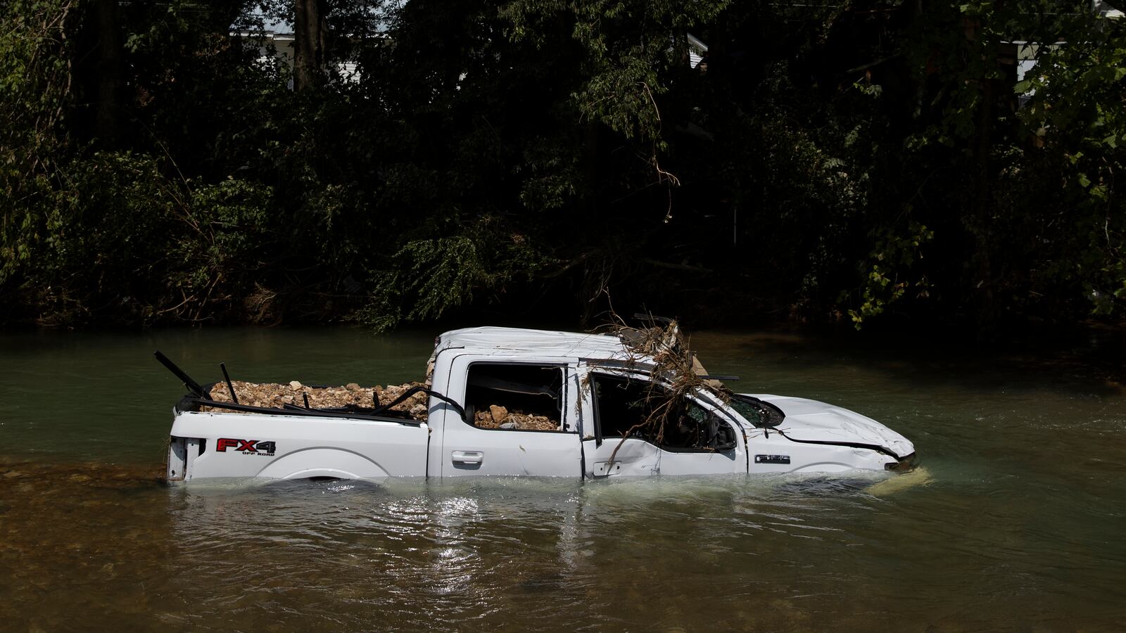 Half submerged truck