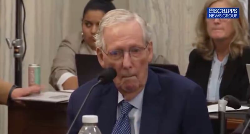 Republican Mitch McConnell is seen freezing and staring blankly during a Senate vote.