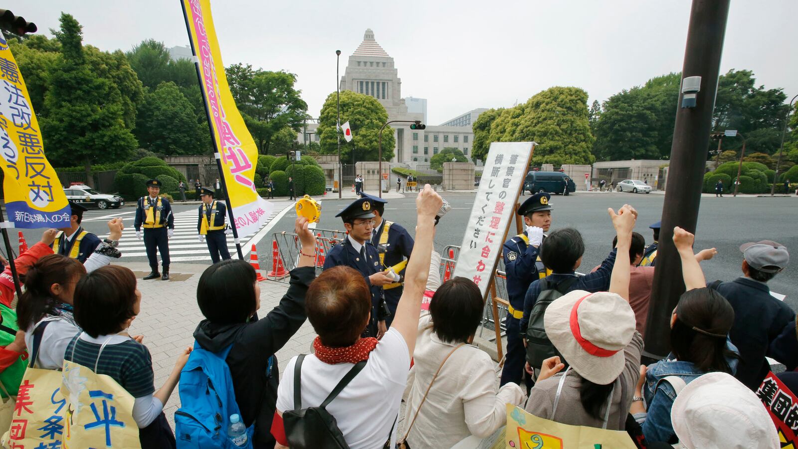 articles/2014/05/14/japanese-women-tell-their-men-they-have-to-choose-between-love-and-war/140514-adelstein-protests-japan-tease_zqnzrq