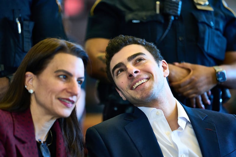 NEW YORK, NEW YORK - DECEMBER 12: Luigi Mangione, with full luster, smiles with defense attorney Karen Friedman Agnifilo.