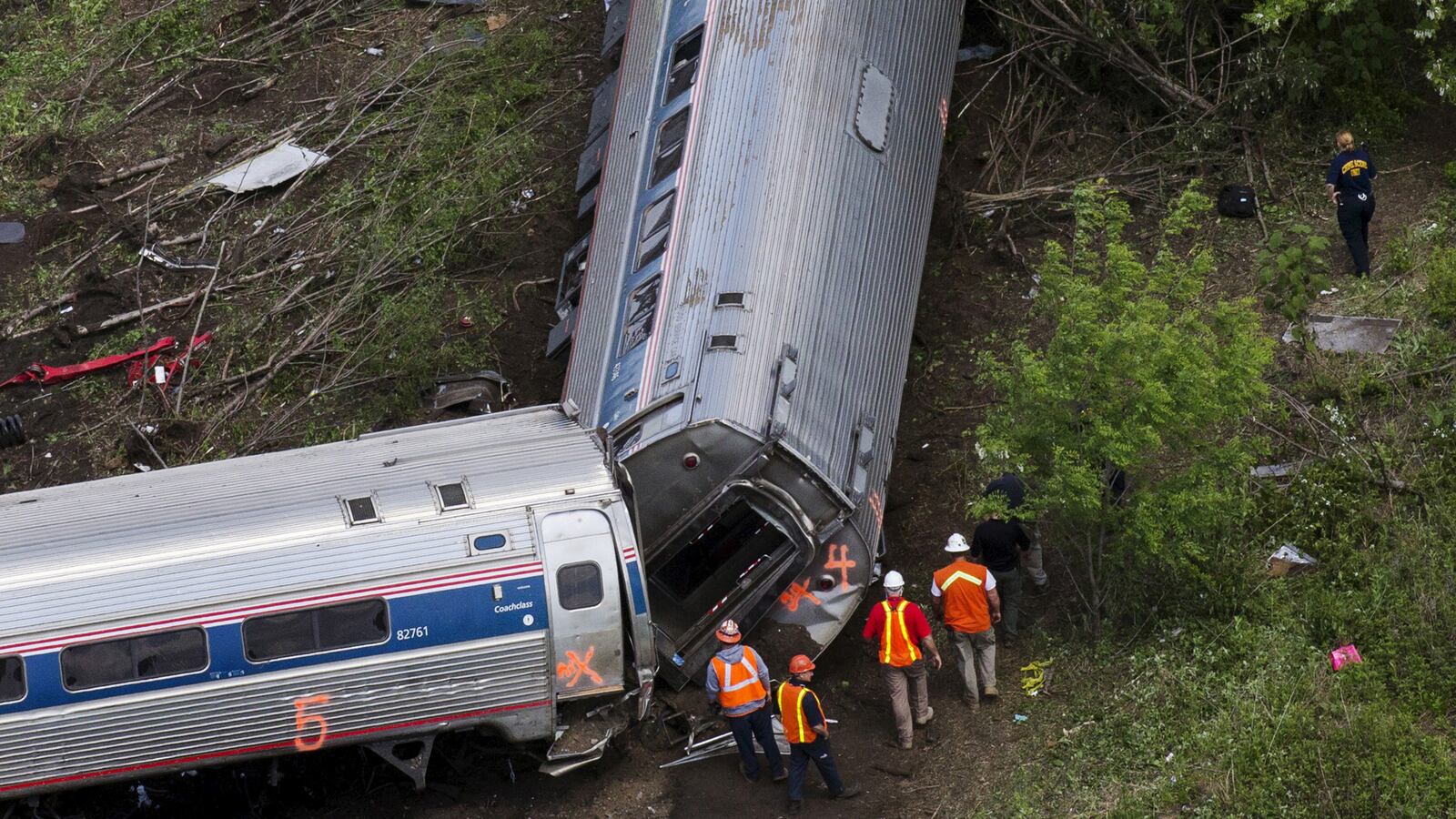 articles/2015/05/13/derailed-amtrak-cars-nearly-hit-bomb-train/150513-pulcini-train-tease_cr5zqb