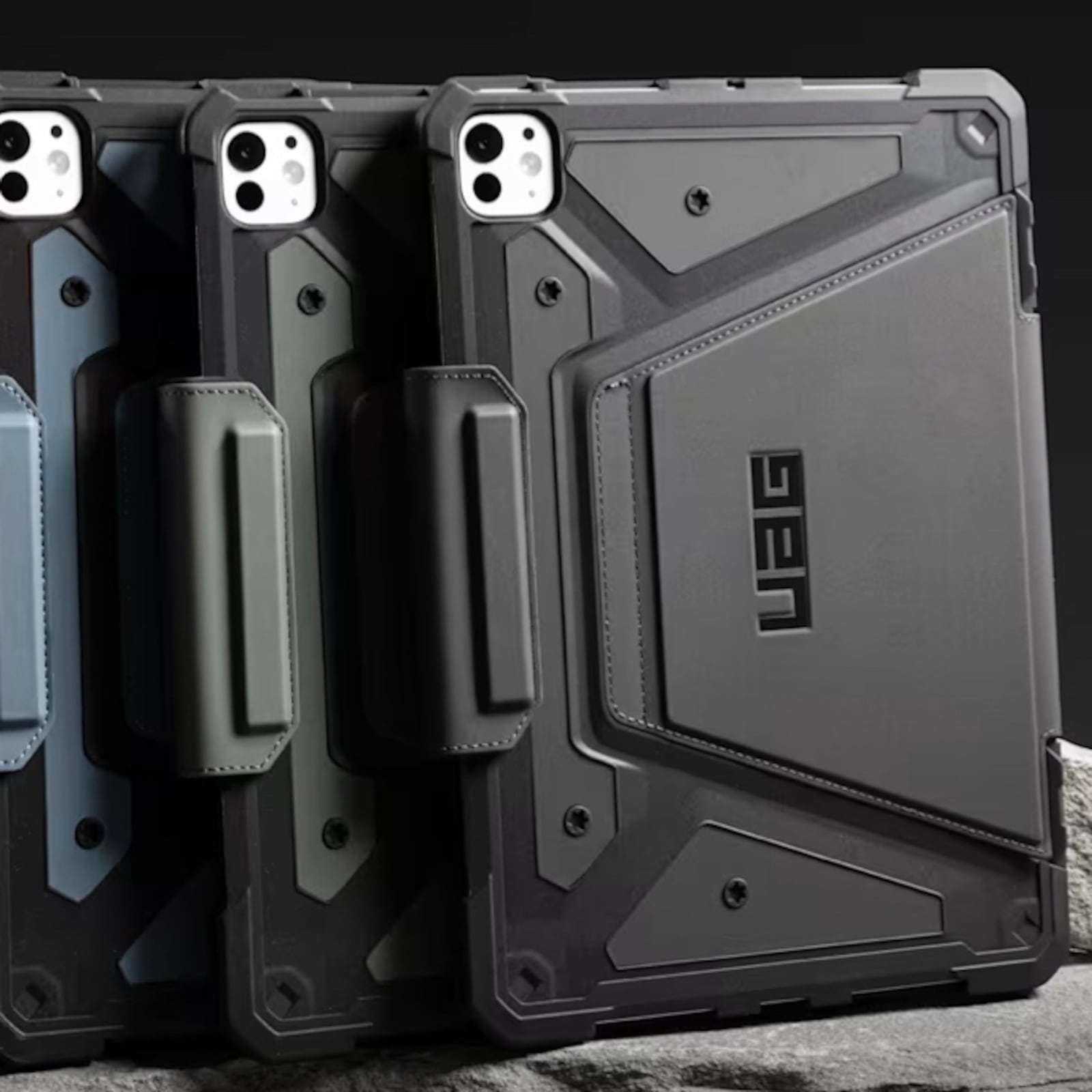 Urban Armor Gear iPad cases on slate slab.