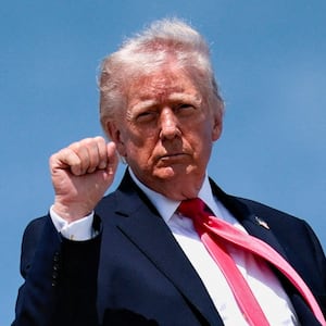 U.S. President Donald Trump makes a fist as he boards Air Force One for his trip to Las Vegas, Nevada, as he departs Joint Base Andrews, Maryland, U.S., on the day he announced that Israeli and Lebanese leaders had agreed to begin a 10-day ceasefire, April 16, 2026. REUTERS/Evan Vucci