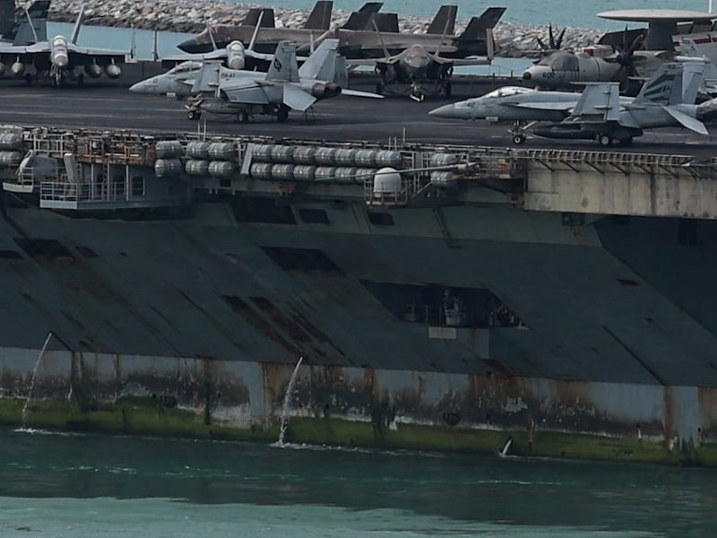 The U.S. Navy Nimitz-class aircraft carrier USS Abraham Lincoln sails toward Laem Chabang Port before docking for a rest stop following a long deployment in the Middle East, with the Pattaya skyline in backdrop, in Chonburi province, Thailand, September 2, 2026. REUTERS/Chalinee Thirasupa