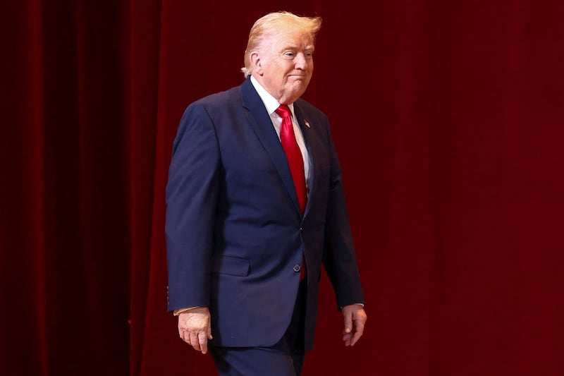 U.S. President Donald Trump walks as he attends the "Shield of the Americas" Summit in Miami, Florida, U.S., March 7, 2026. REUTERS/Kevin Lamarque