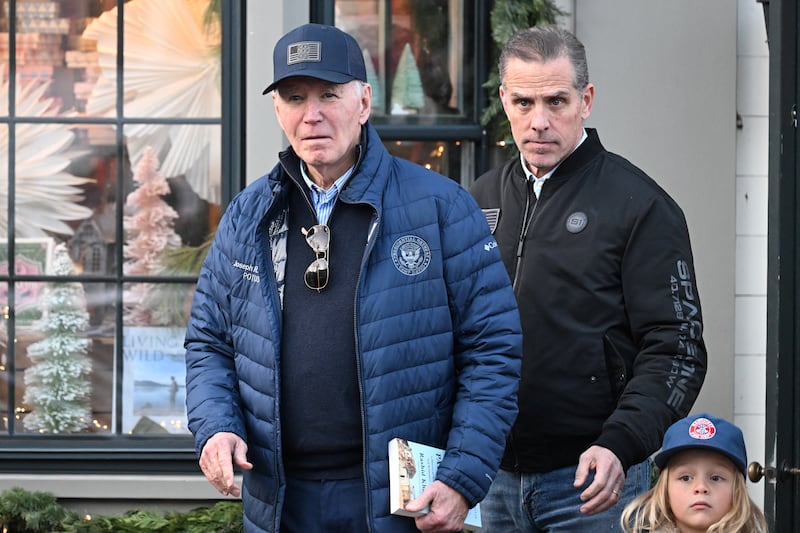 U.S. President Joe Biden, accompanied by Hunter Biden and Beau Jr., walks out of a bookstore in downtown Nantucket, Massachusetts, U.S., November 29, 2024. REUTERS/Craig Hudson