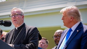 WASHINGTON, DC - MAY 01: Bishop Robert Barron (L), accompanied by U.S. President Donald Trump, and other religious leaders, speaks during a National Day of Prayer event in the Rose Garden at the White House on May 1, 2025 in Washington, DC. The National Day of Prayer is a congressionally recognized observance that calls on people of all faiths to participate in a day of prayer and reflection. (Photo by Andrew Harnik/Getty Images)