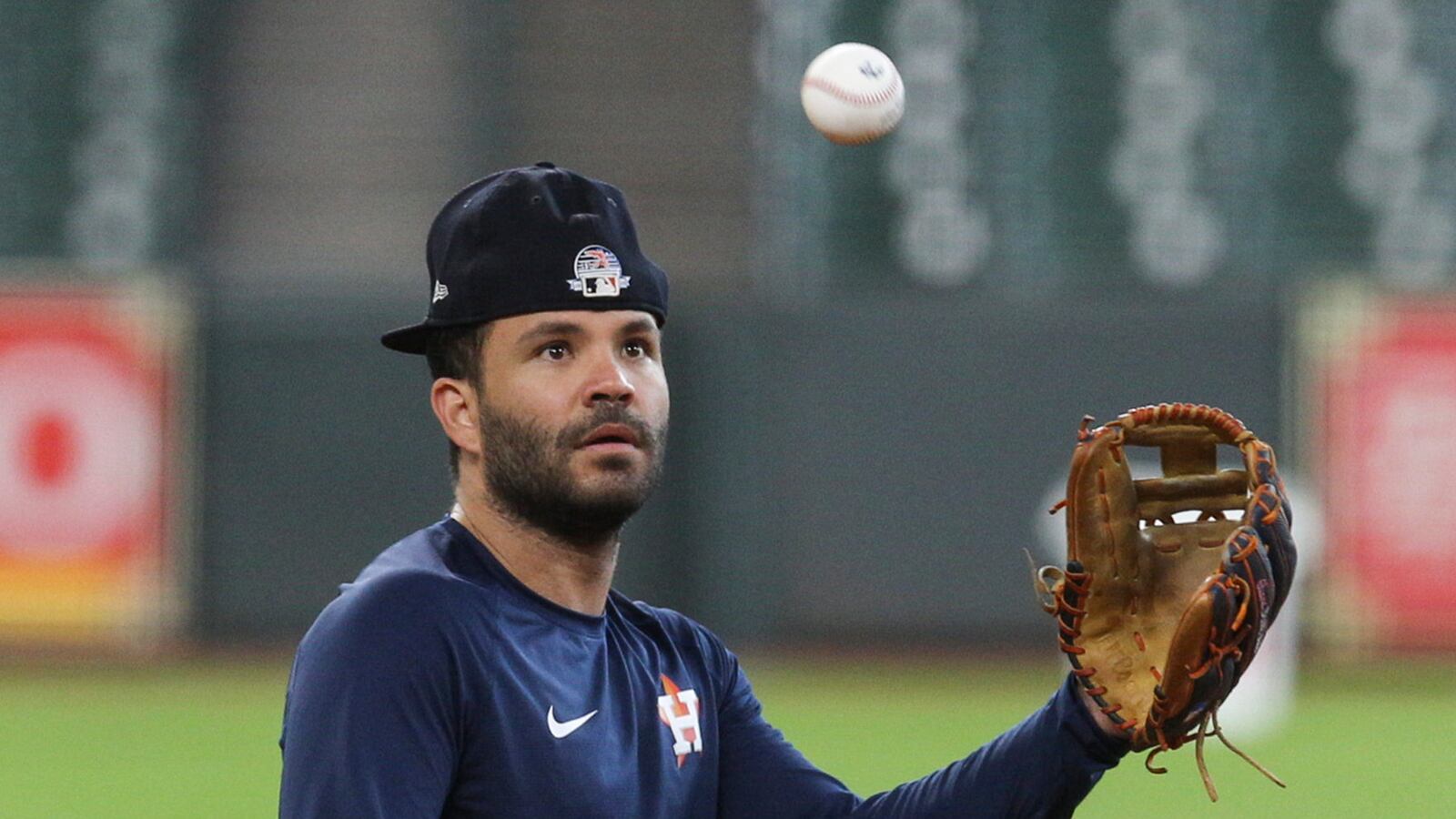 Houston Astros second baseman Jose Altuve (27) fields a ball during practice at Minute Maid Park.
