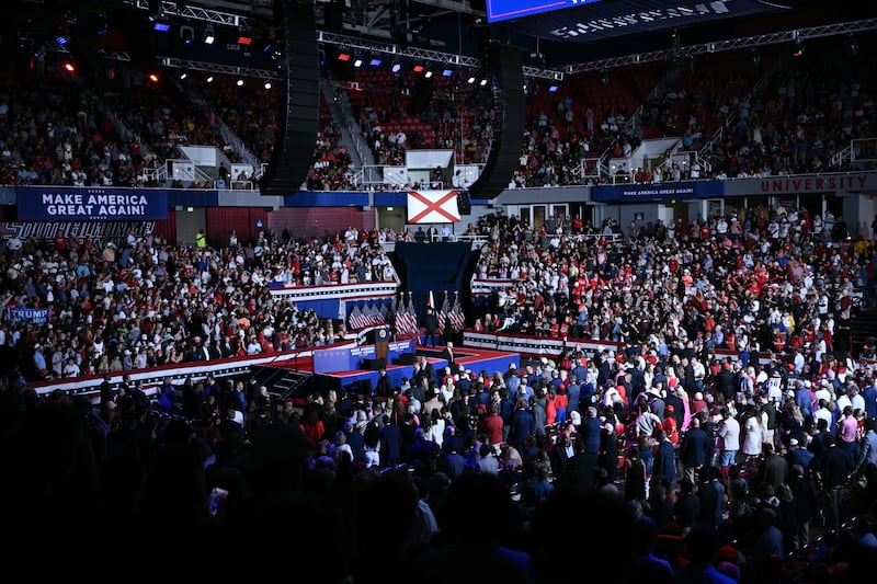 Supporters of U.S. President Donald Trump wait for him to speaks at a midterm campaign rally at The Mitchell Center of the University of South Alabama in Mobile, Alabama on October 2, 2026.