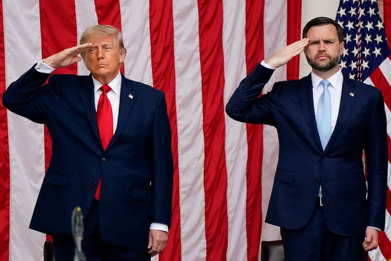 U.S. President Donald Trump and U.S. Vice President JD Vance salute in the Memorial Amphitheater during a Memorial Day event at Arlington National Cemetery, Arlington, Virginia, U.S., May 25, 2026.