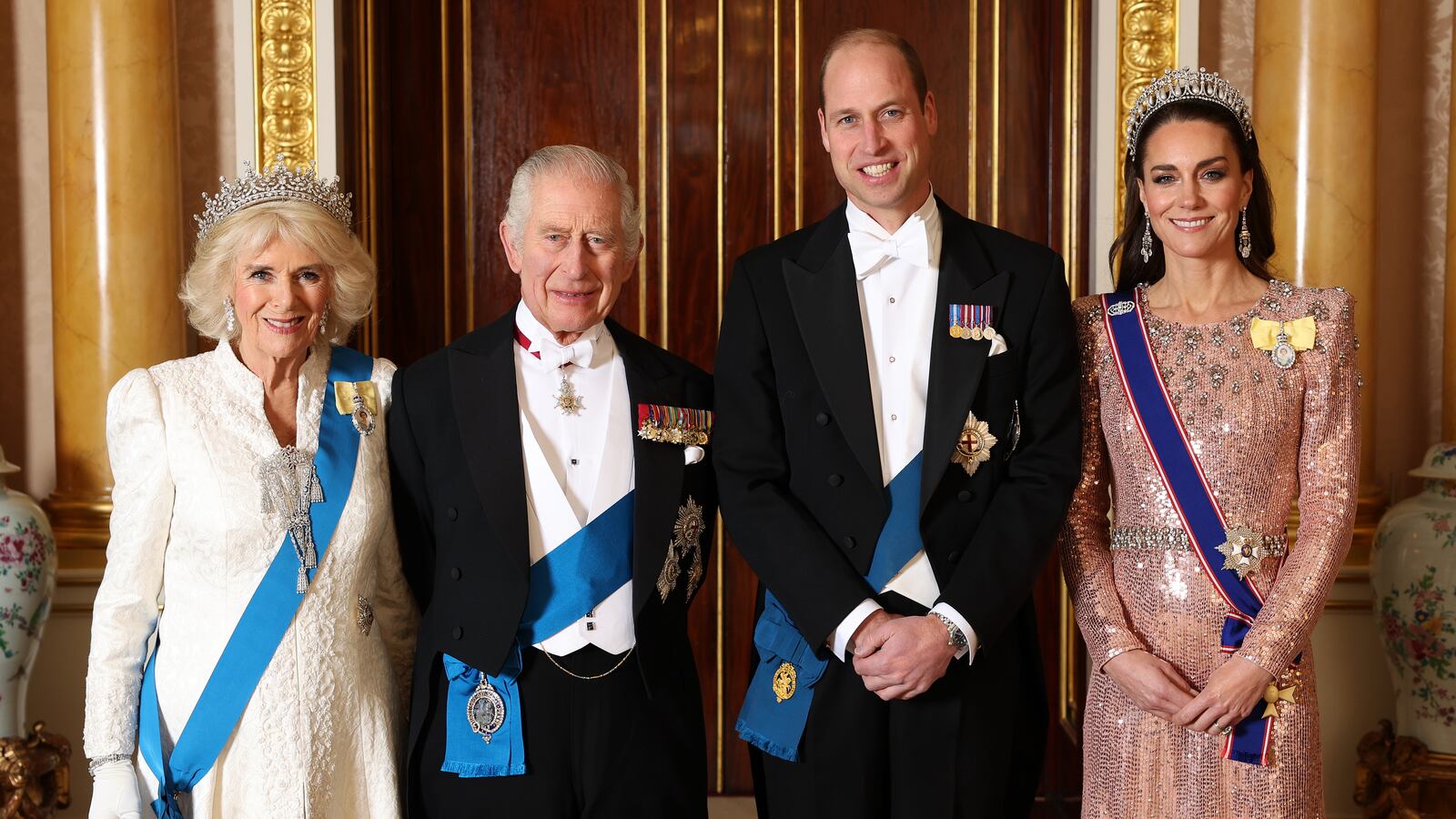 Queen Camilla, King Charles III, Prince William, Prince of Wales and Catherine, Princess of Wales pose for a photograph ahead of the Diplomatic Reception in the 1844 Room at Buckingham Palace.