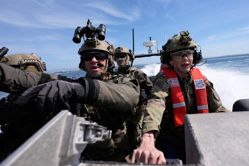 Kristi Noem (R) pilots a US Coast Guard Response Boat-Small (RBS) with the Maritime Security Response Team in San Diego, California, on March 16, 2025.