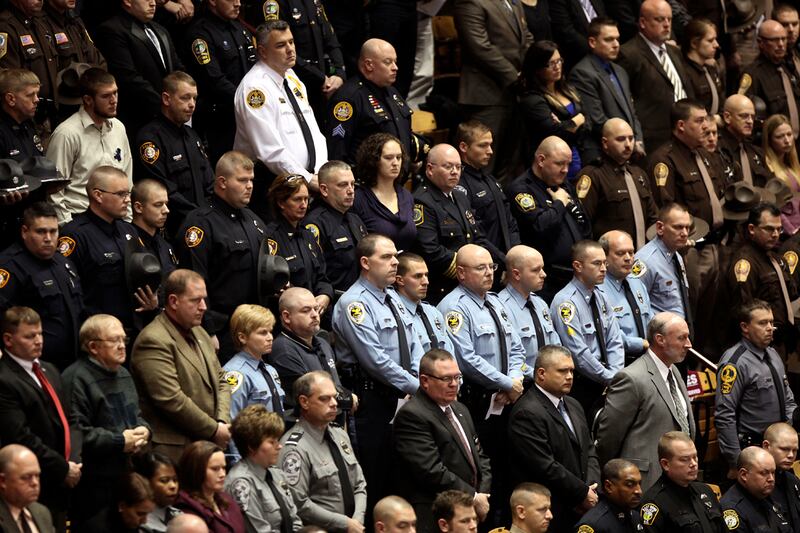 articles/2011/12/17/more-cops-shot-as-felons-buy-illegal-guns-online/cops-guns-dzieza_bmaygk