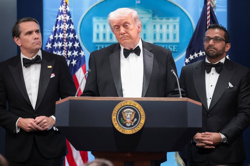 U.S. President Donald Trump speaks next to Federal Bureau of Investigation (FBI) Director Kash Patel and acting Attorney General Todd Blanche at a press briefing at the White House, following a shooting incident during the annual White House Correspondents’ Association dinner, in Washington, D.C., U.S., April 25, 2026