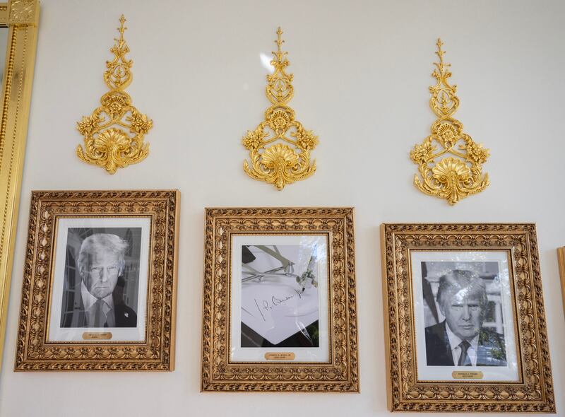 White House RenovationsFramed portraits of US President Donald Trump flank a image of former US President Joe Biden's signature and an autopen along "The Presidential Walk of Fame" on the wall of the colonnade outside of the Oval Office at the White House on October 5, 2025 in Washington, DC. Trump is headed to Norfolk to attend the US Navy's 250th anniversary celebrations. (Photo by ANDREW CABALLERO-REYNOLDS / AFP) (Photo by ANDREW CABALLERO-REYNOLDS/AFP via Getty Images)