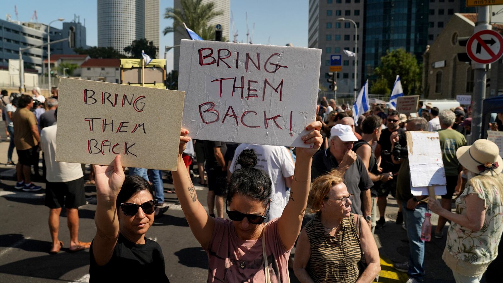 Demonstrators holding signs in Israel.