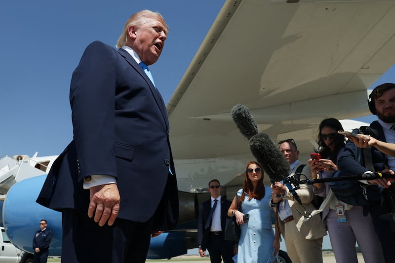 U.S. President Donald Trump speaks to members of the media as he arrives at Joint Base Andrews in Maryland, U.S., May 20, 2026.