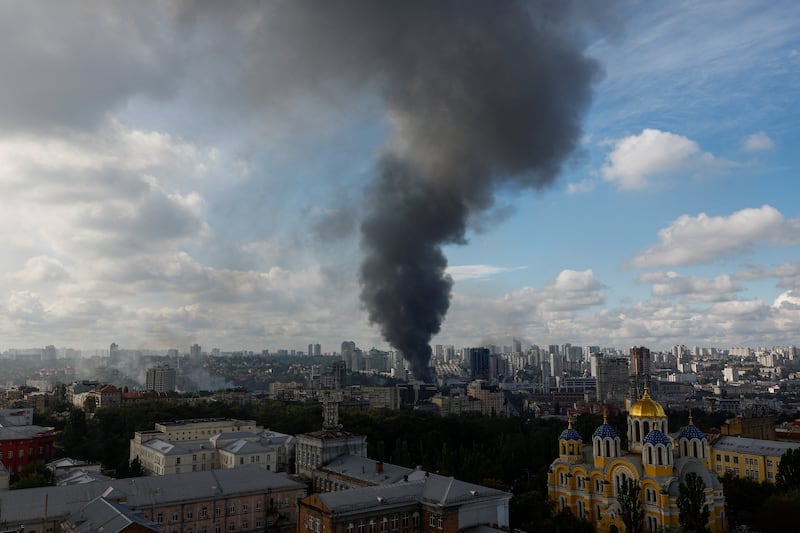 Smoke rises over the city