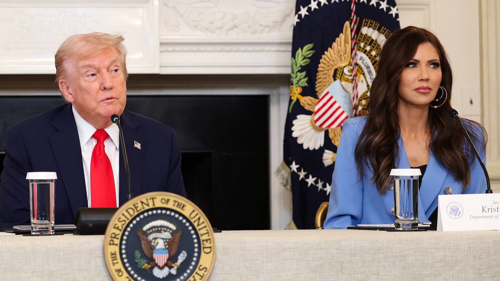 President Donald Trump with then Homeland Security Secretary Kristi Noem speak during a roundtable on October 8, 2025.