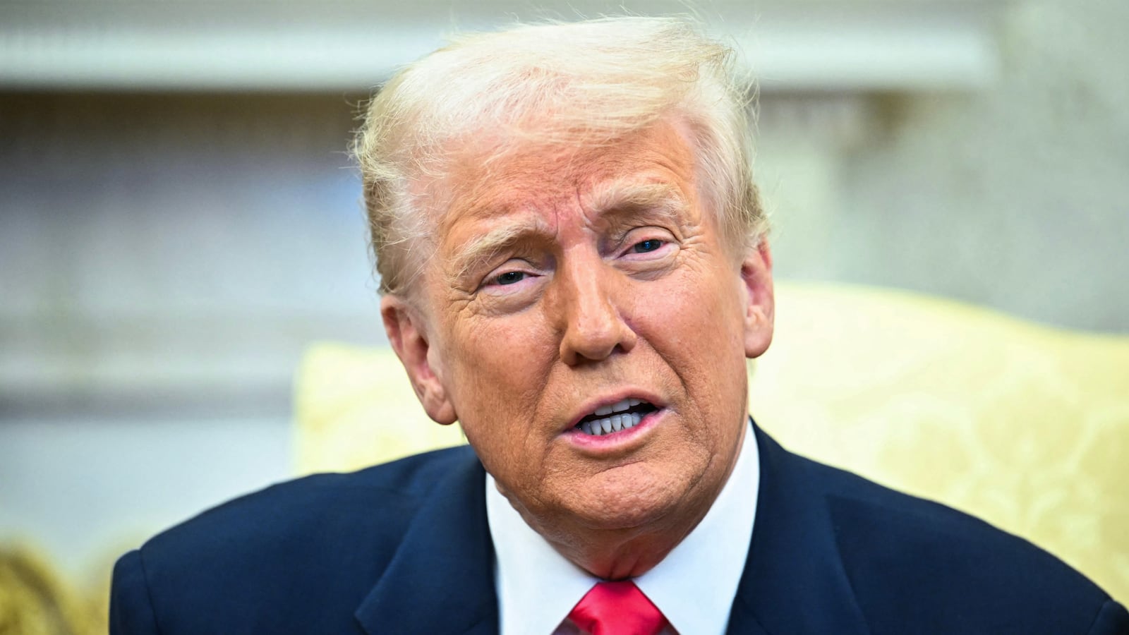 US President Donald Trump speaks to reporters.